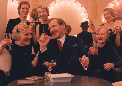 Ralph Fiennes and ladies in The Grand Budapest Hotel